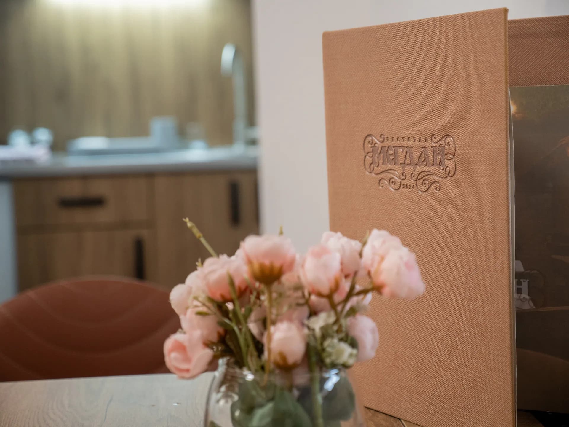 Apartment I — flowers on the table and the Restaurant Megdan menu