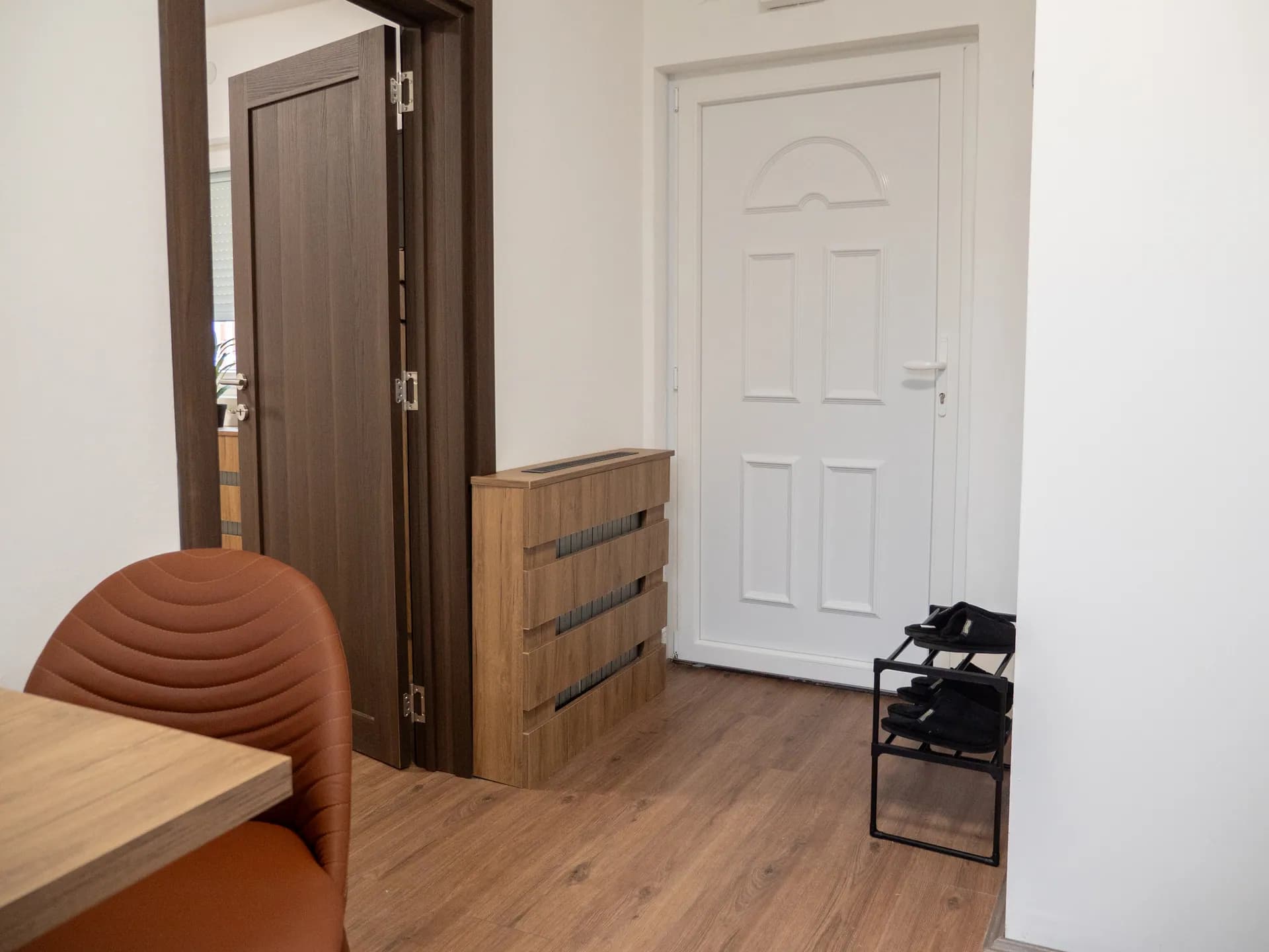 Apartment II — the hallway with the front door and a shoe rack